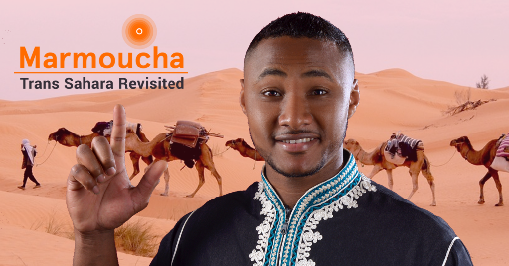 Aziz Ozouss against the background of a Sahara caravan, presenting the Marmoucha Orchestra production "Trans Sahara Revisited"